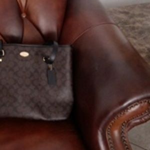 A coach black and brown purse